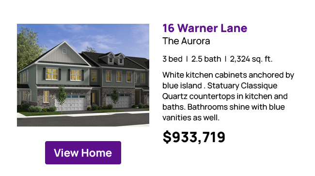 16 Warner Lane - The Aurora - 3 bed  |  2.5 bath  |  2,324 sq. ft. White kitchen cabinets anchored by blue island . Statuary Classique Quartz countertops in kitchen and baths. Bathrooms shine with blue vanities as well. $933,719 View Home